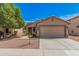Charming single-Gathering home featuring a two-car garage, desert landscaping and mature shade tree at 12109 N 127Th Dr, El Mirage, AZ 85335