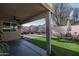 Spacious covered patio with ceiling fan provides a shaded retreat overlooking the well-maintained backyard at 13034 W Cheery Lynn Rd, Avondale, AZ 85392