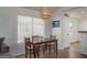 Cozy dining area with a modern light fixture and a window providing ample natural light at 13034 W Cheery Lynn Rd, Avondale, AZ 85392