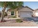 Charming home with a two-car garage, desert landscaping, and stone accents, offering great curb appeal at 13034 W Cheery Lynn Rd, Avondale, AZ 85392