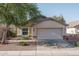 Charming single-story home featuring desert landscaping and a two-car garage, with easy street access at 13034 W Cheery Lynn Rd, Avondale, AZ 85392