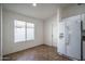Bright breakfast nook with a window featuring tile flooring, adjacent to the kitchen area at 13034 W Cheery Lynn Rd, Avondale, AZ 85392