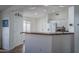Open kitchen layout features granite countertops, with white cabinets, and stainless steel appliances at 13034 W Cheery Lynn Rd, Avondale, AZ 85392