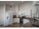 Well-appointed kitchen with white cabinets, granite countertops, and stainless steel appliances at 13034 W Cheery Lynn Rd, Avondale, AZ 85392