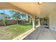 Covered patio leads to a spacious, well-maintained backyard with lush green grass at 1361 E Sheffield Ave, Gilbert, AZ 85296