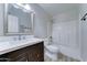 Bathroom features wood vanity, white marble countertop, tub and shower at 1361 E Sheffield Ave, Gilbert, AZ 85296