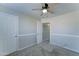 Bedroom with a ceiling fan, plush carpeting, and a doorway into another room at 1361 E Sheffield Ave, Gilbert, AZ 85296