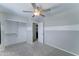 Bedroom with a ceiling fan, a closet, and a doorway into the en-suite bathroom at 1361 E Sheffield Ave, Gilbert, AZ 85296