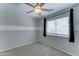 Bedroom with a ceiling fan and carpeted flooring with natural light from the window at 1361 E Sheffield Ave, Gilbert, AZ 85296