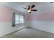 Charming bedroom featuring a decorative ceiling fan and light pink walls at 1361 E Sheffield Ave, Gilbert, AZ 85296