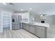 Modern kitchen boasts stainless steel appliances, quartz countertops, and gray and white cabinetry at 1361 E Sheffield Ave, Gilbert, AZ 85296