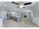 Expansive living space with a modern kitchen, dining area, and stylish flooring throughout at 1361 E Sheffield Ave, Gilbert, AZ 85296