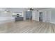 Inviting living area with updated flooring, open to the kitchen, and includes a staircase at 1361 E Sheffield Ave, Gilbert, AZ 85296