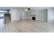 Bright, open living room features new flooring, a fireplace, and a staircase at 1361 E Sheffield Ave, Gilbert, AZ 85296