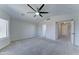 Large main bedroom offering plush carpets, ceiling fan, and attached bathroom at 1361 E Sheffield Ave, Gilbert, AZ 85296