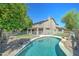 Backyard pool featuring mature landscaping, and partial safety fence at 1361 E Sheffield Ave, Gilbert, AZ 85296