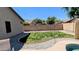 Well-maintained backyard with artificial turf and rock border at 14968 N 134Th Ln, Surprise, AZ 85379