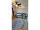 Cozy Bedroom with carpet, a ceiling fan, and a gray crib at 14968 N 134Th Ln, Surprise, AZ 85379