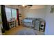 Bedroom with a gray crib, carpet, and a ceiling fan at 14968 N 134Th Ln, Surprise, AZ 85379