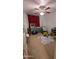 bedroom with bright accents, play area, and ceiling fan at 14968 N 134Th Ln, Surprise, AZ 85379