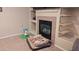 Cozy living room with a fireplace and built-in shelves at 14968 N 134Th Ln, Surprise, AZ 85379