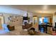 Inviting living room with tile floors, a fireplace, and a dining area at 14968 N 134Th Ln, Surprise, AZ 85379