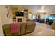 Cozy living room featuring a fireplace, ceiling fan, tile floors, and comfortable seating at 14968 N 134Th Ln, Surprise, AZ 85379
