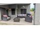 Covered patio featuring outdoor seating, ceiling fan, and fire pit at 14968 N 134Th Ln, Surprise, AZ 85379