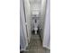 Powder room with toilet, cabinet storage, and tile flooring at 14968 N 134Th Ln, Surprise, AZ 85379