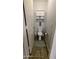 View of a clean, compact toilet room with cabinet and tiled floor at 14968 N 134Th Ln, Surprise, AZ 85379