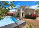 Serene backyard featuring a refreshing pool, spacious patio, balcony, and colorful landscaping for outdoor living at 15034 S 44Th Pl, Phoenix, AZ 85044