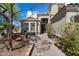 Beautiful front entry with a stone path, mature trees, and a seating bench at 15034 S 44Th Pl, Phoenix, AZ 85044