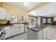 Bright kitchen with white cabinets, granite countertops, stainless steel appliances, and an island at 15034 S 44Th Pl, Phoenix, AZ 85044
