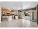 Bright kitchen with island, leading to patio doors and pool access at 15034 S 44Th Pl, Phoenix, AZ 85044