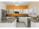 Modern kitchen featuring granite counters, white cabinets, and stainless steel appliances at 15034 S 44Th Pl, Phoenix, AZ 85044