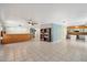 Large open living space with bar and adjacent kitchen area at 15034 S 44Th Pl, Phoenix, AZ 85044