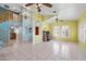 Expansive living room with high ceilings, tile floors, an open staircase, and an adjacent office area at 15034 S 44Th Pl, Phoenix, AZ 85044