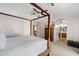 Bedroom with a four poster bed, ceiling fan, television, and en suite bathroom at 15034 S 44Th Pl, Phoenix, AZ 85044