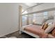 Cozy bedroom with unique bed frame, neutral color palette, and plenty of natural light at 1554 E Kings Ct, Gilbert, AZ 85234