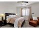 Inviting bedroom with plush carpet, shuttered windows, and a comfortable seating area at 1554 E Kings Ct, Gilbert, AZ 85234