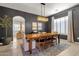 Elegant dining room features a large wooden table, stylish chandelier, and neutral decor at 1554 E Kings Ct, Gilbert, AZ 85234