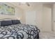 Comfortable bedroom featuring stylish bedding and an overhead fan for optimal climate control at 16675 W Taylor St, Goodyear, AZ 85338