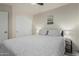 The bedroom features a ceiling fan, closet, and stylish side tables at 16675 W Taylor St, Goodyear, AZ 85338
