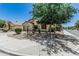 Inviting single-story home featuring desert landscaping in the front yard and an attached two-car garage at 16675 W Taylor St, Goodyear, AZ 85338