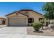 Attractive single-story home featuring a low maintenance front yard and an attached two-car garage at 16675 W Taylor St, Goodyear, AZ 85338