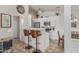 Eat-in kitchen boasts breakfast bar with seating, sleek appliances, and decorative accents at 16675 W Taylor St, Goodyear, AZ 85338