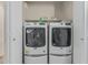 A well-organized laundry area with modern, front-loading washer and dryer at 16675 W Taylor St, Goodyear, AZ 85338