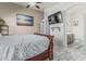 Bright main bedroom with connected ensuite bathroom featuring modern fixtures and finishes at 16675 W Taylor St, Goodyear, AZ 85338