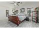 Spacious main bedroom with vaulted ceilings, wood-look tile, and natural light from the windows at 16675 W Taylor St, Goodyear, AZ 85338