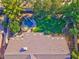 Aerial view of a well-maintained backyard with a pool, lush lawn, and patio area at 1681 S Karen Dr, Chandler, AZ 85286
